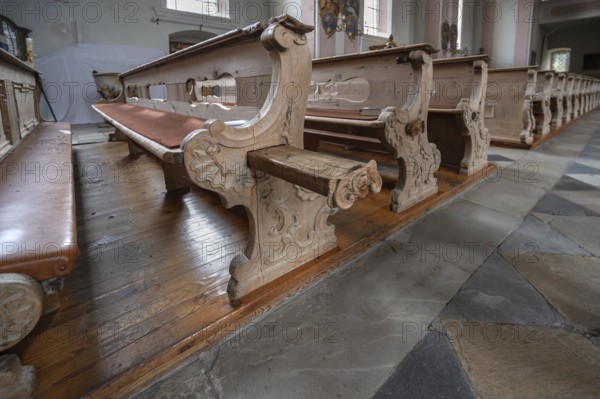 Pull-out emergency seats on the pews, Heilger Pankratius church, BahnstraÃŸe 1, Telfes im Stubai, Austria