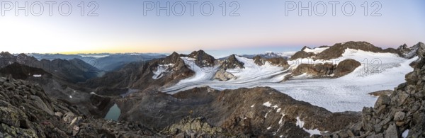 Mountain panorama, picturesque high mountain landscape at sunrise, blue glacial lakes, glaciers and rocky mountain peaks, view of the Königshofspitz and Sonklarspitze mountain peaks and Schwarzwandspitz with Ãœbeltalferner glacier, Stubai Alps, South Tyrol, Italy