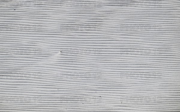 Close-up of a sandy area with fine, wavy lines in shades of grey, near Hvide Sande, North Sea, Denmark