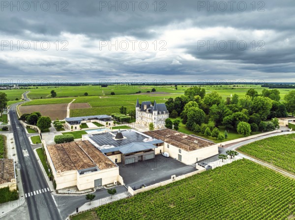 Chateau Pichon Longueville Baron Vineyard and grape fields around Pauillac from a drone, Bordeaux, Gironde, Nouvelle-Aquitaine, France