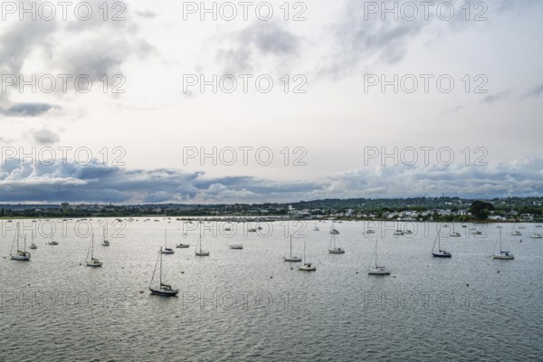 Yachts over Ramshorn Lake and Poole, Brownsea, Dorset, England, United Kingdom