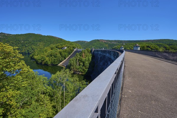 Long, curvy bridge with dam and surrounding forest under a clear sky, summer, Urft dam wall, Obersee, Urftsee, Schleiden, Eifel National Park, Eifel, North Rhine-Westphalia, Germany