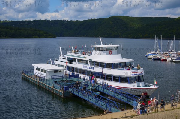 Passenger ship Stella Maris, at the landing stage, with tourists and neighbouring boats, summer, Rursee, Rurtalsperre, Heimbach, Simmerath, Eifel National Park, North Rhine-Westphalia, Germany