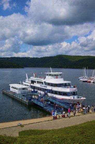 Passenger ship Stella Maris, with tourists at the landing stage, at the harbour, cloudy sky, summer, Rursee, Rurtalsperre, Heimbach, Simmerath, Eifel National Park, North Rhine-Westphalia, Germany