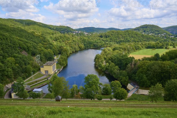 Quiet river dam surrounded by green hills and forests under a cloudy sky, summer, Rursee, Rurtalsperre, Heimbach, Simmerath, Eifel National Park, North Rhine-Westphalia, Germany