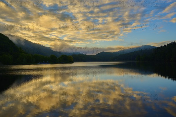 Reflection of clouds on a calm lake at dusk, summer, Rursee, Obersee, Rurberg, Simmerath, Eifel National Park, North Rhine-Westphalia, Germany