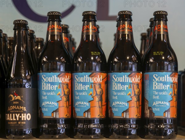 Adnams beer products on display inside brewery shop, Southwold, Suffolk, England, UK - Southwold bitter bottles