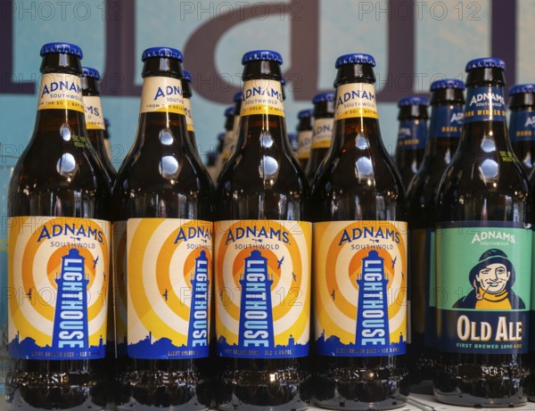 Adnams beer products on display inside brewery shop, Southwold, Suffolk, England, UK - Lighthouse beer bottles