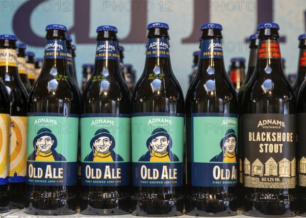 Adnams beer products on display inside brewery shop, Southwold, Suffolk, England, UK - Old Ale bottles