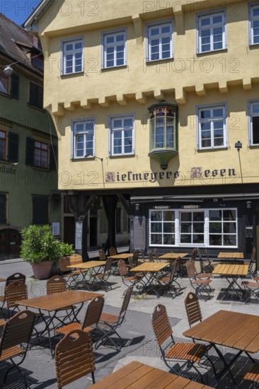 Detail view of a historic half-timbered house and outdoor catering of the restaurant Kielmeyer's Besen in the old town of Esslingen, Esslingen am Neckar, district of Esslingen, Baden-WÃ¼rttemberg, Germany