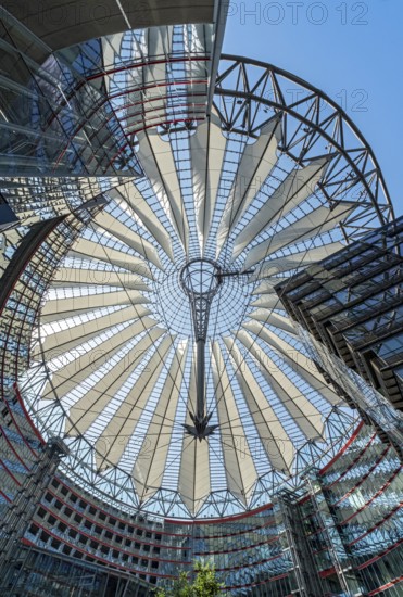 Low-angle view of the glass roof of Das Center at Potsdamer Platz, formerly known as the Sony Center, Berlin, Germany
