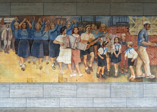 Close-up of the GDR-era Max Lingner propaganda mural, Detlev Rohwedder House, Berlin, Germany
