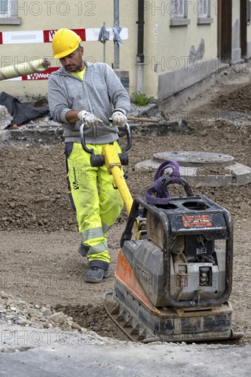 Construction site Road construction Construction worker Vibratory plate