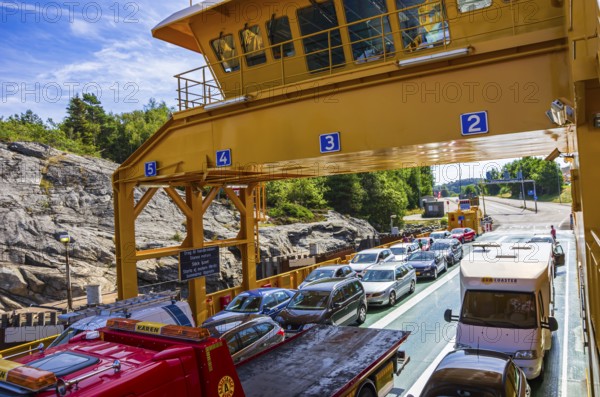Cars and lorries on a car ferry operating as a floating road, near Lysekil, BohuslÃ¤n, VÃ¤stra Götalands lÃ¤n, Sweden, Scandinavia, for editorial use only
