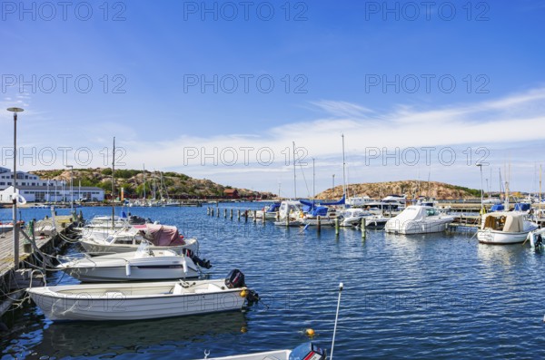Boats moored at the jetty in the marina in the northern harbour (Norra Hamnen) of Lysekil, BohuslÃ¤n, VÃ¤stra Götalands lÃ¤n, Sweden, Scandinavia, for editorial use only