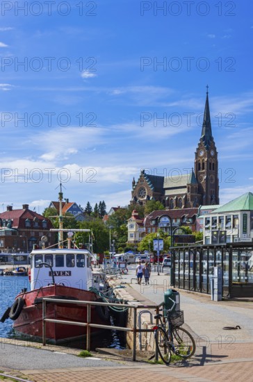 South harbour with house front and church, Lysekil, BohuslÃ¤n, VÃ¤stra Götalands lÃ¤n, Sweden, Scandinavia