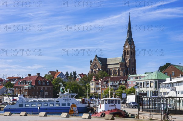 South harbour with house front and church, Lysekil, BohuslÃ¤n, VÃ¤stra Götalands lÃ¤n, Sweden, Scandinavia