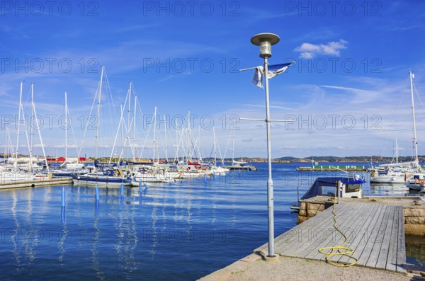 Picturesque scenery of sailing boats in the marina on the waterfront in the harbour of Lysekil, BohuslÃ¤n, VÃ¤stra Götalands lÃ¤n, Sweden, Scandinavia
