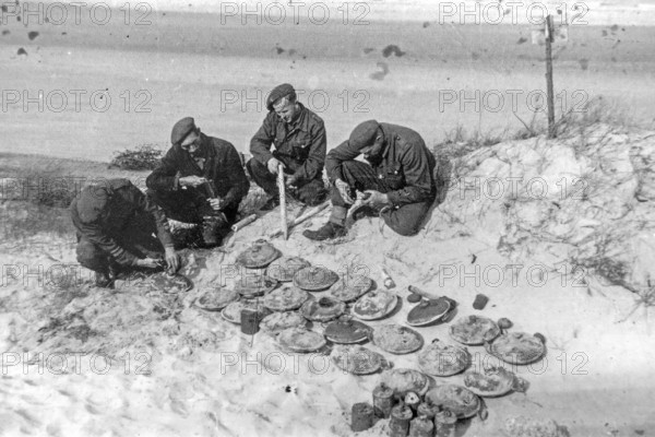 WW2 German anti-tank Teller mines and S-mines cleared in the dunes at Atlantikwall Raversyde by Belgian bomb squad after World War Two, Belgium