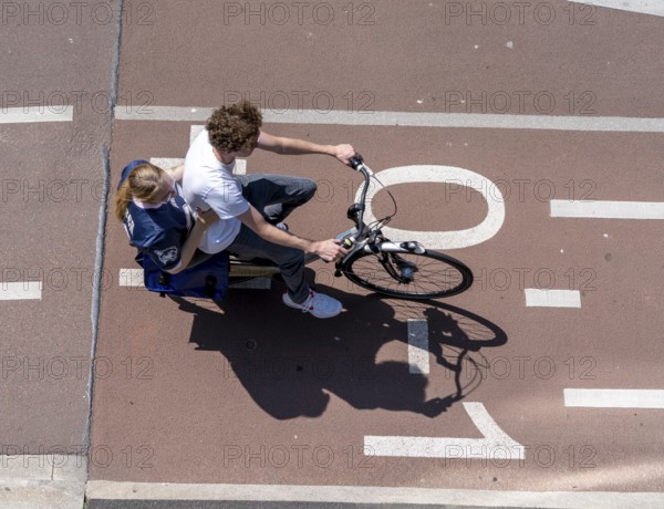 Cycling in the Netherlands, Utrecht, typical riding style with 2 people on one bike