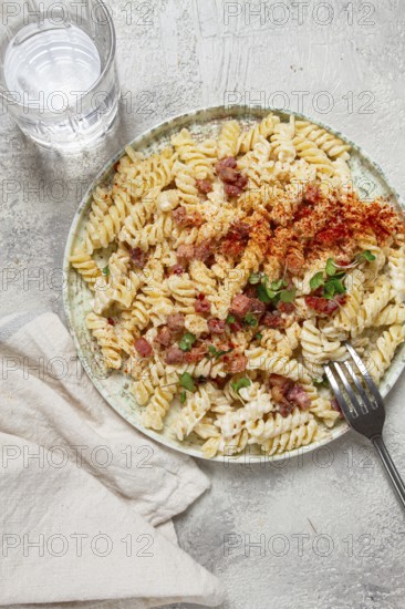 Fusilli pasta with cheese and bacon, homemade, no people