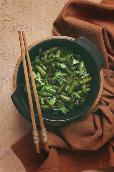 Fried bean pods, in soy sauce, with sesame seeds, homemade, no people