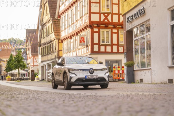 A car in a historic street with half-timbered houses, Deer E, car sharing, electric car, Calw, Black Forest