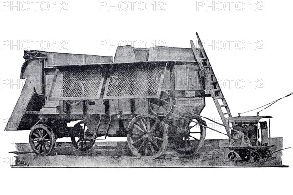 Agriculture, harvest, threshing machine in operation, powered by electricity, Wolf company, Magdeburg, around 1870, digitally enhanced reproduction of a 19th century model, historical, exact date unknown