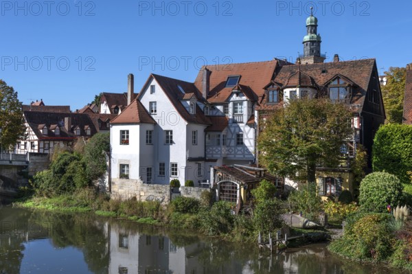 Old town houses located on the Pegnitz, behind the tower of St. John's Church, Lauf an der Pegnitz, Middle Franconia, Bavaria, Germany