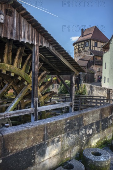 Waterwheel of the historic Schleifmühle, behind the Judenturm, built in 1430, former part of the fortress wall, Höllgasse, Lauf an der Pegnitz, Middle Franconia, Bavaria, Germany