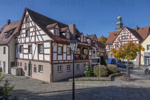 Historic half-timbered houses in the old town, tower of St. John's Church in the back, Lauf an der Pegnitz, Middle Franconia, Bavaria, Germany