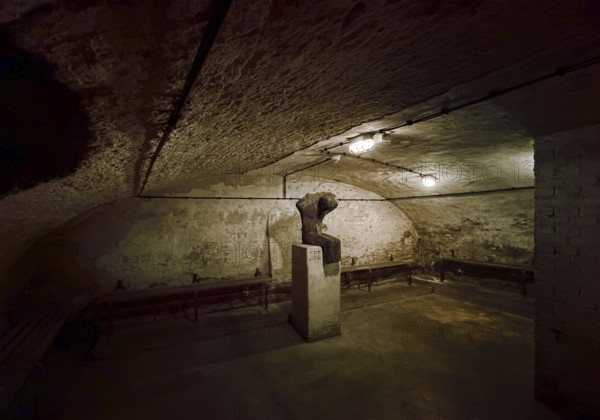 Historic air raid shelter, memorial and memorial with the sculpture Victims by Thomas Duttenhöfer, Düsseldorf, North Rhine-Westphalia, Germany