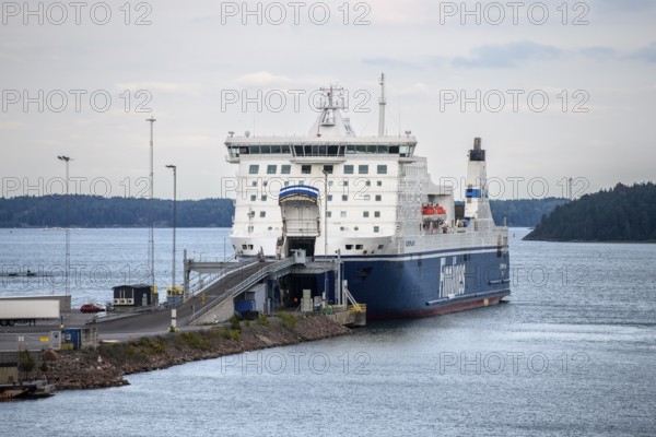 Large ferry on the Finnlines line Naantali Kappelskär in Naantali harbour over calm water, industrial and maritime atmosphere, Naanatali, Varsinais-Suomi, Finland