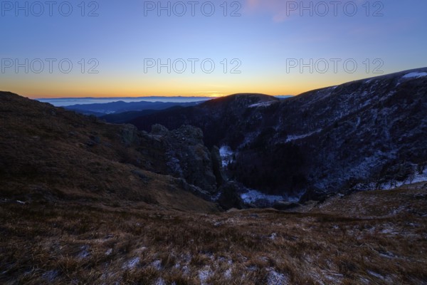 First rays of light over mountain peaks, cool morning with purple sky, view of the Rhine Valley, Martinswand, Frankental, Vosges, France