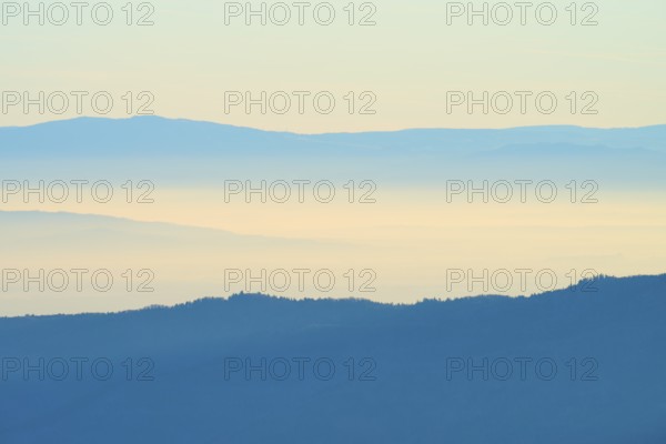 Wide mountain landscape, sunrise with soft shades of blue, view of the Rhine Valley, Hohneck, La Bresse, Vosges, France
