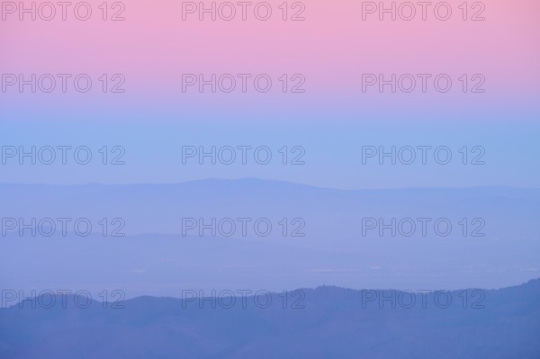 Rolling hills under a pink and blue sky at sunset, looking towards the Rhine Valley, Hohneck, La Bresse, Vosges, France