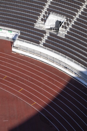 Modern stadium stand with empty seats, outdoor stairs and tartan track, Helsinki Olympic Stadium, architects Yrjö Lindegren and Toivo Jäntti, Helsinki, Finland