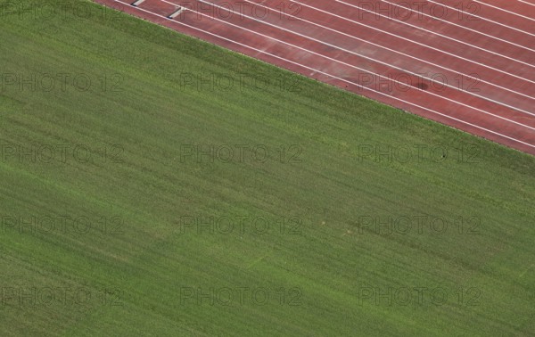 View of well-maintained stadium lawn and tartan track from the Olympic Stadium tower, Helsinki, Finland