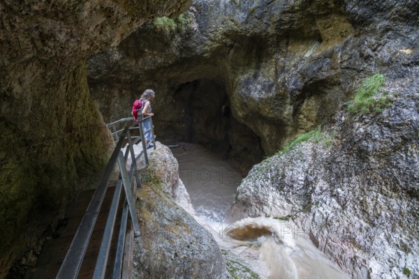 Woman hiking in the Almbach Gorge, Berchtesgaden Biosphere Reserve, Almbach, Berchtesgaden Alps, Upper Bavaria, Germany