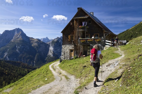 Woman in front of Plumsjochhütte, Plumsjoch, hiker, Karwendel Mountains, Austria