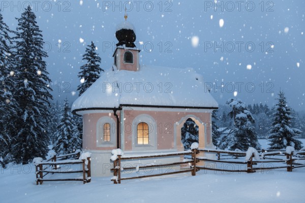 Maria-Königin chapel on Lautersee during snowfall, Werdenfelser Land, Upper Bavaria, Germany