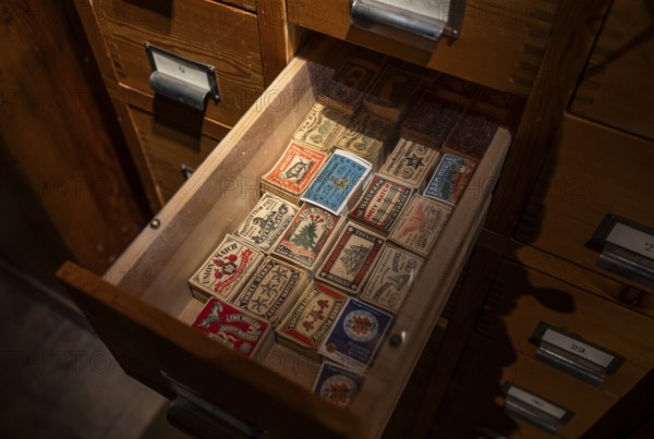 Historical matchbox labels, various motifs, in wooden drawer, Tändsticksmuseet matchstick museum or match museum, Jönköping, Jönköpings län, Sweden