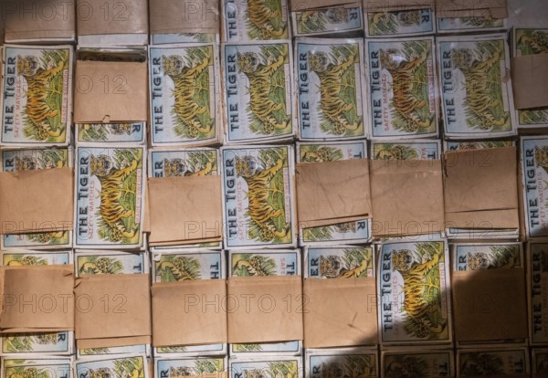 Historical labels depicting tigers for matchboxes are bundled in a box, Tändsticksmuseet matchstick museum or match museum, Jönköping, Jönköpings län, Sweden