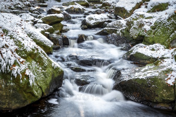 Lower Ilse Falls with snow and moss covered rocks in winter, Heinrich-Heine-Weg, Ilsetal, Harz National Park, Saxony-Anhalt, Germany