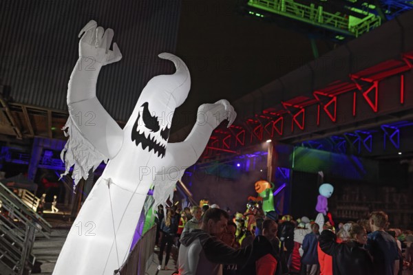 Illuminated ghost figure at Halloween Run, night run in the Dusiburg-Nord Landscape Park, Duisburg, Germany, North Rhine-Westphalia, Germany