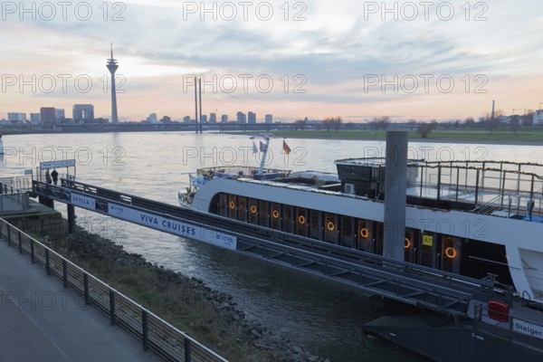 Viva Cruises river cruise ship anchored on Düsseldorf's banks of the Rhine, twilight, Düsseldorf, North Rhine-Westphalia, Germany
