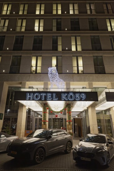 Hotel Kö 59, 5-star luxury hotel, Christmas decoration at the entrance, evening, Düsseldorf, North Rhine-Westphalia, Germany