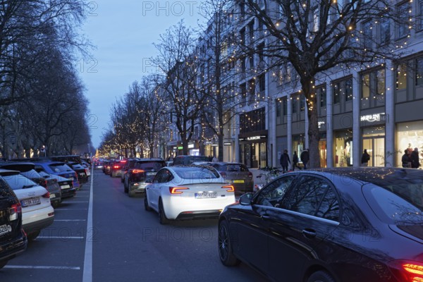 Long car queue on the Kö, shopping traffic at Christmas, twilight, Düsseldorf, North Rhine-Westphalia, Germany