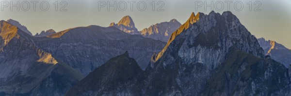 Mountain panorama at sunrise from Nebelhorn, 2224 m, to Höfats 2259 m, behind it the Große Krottenkopf illuminated by the morning sun, 2656m Allgäu Alps, Allgäu, Bavaria, Germany