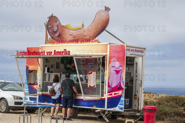 Food truck selling 'last Bratwurst before America', cape Cabo de Sao Vicente, Algarve, Portugal